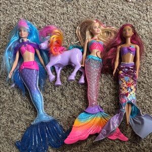 3 Barbie Dreamtopia Rainbow Magic Mermaid doll and a small unicorn toy.